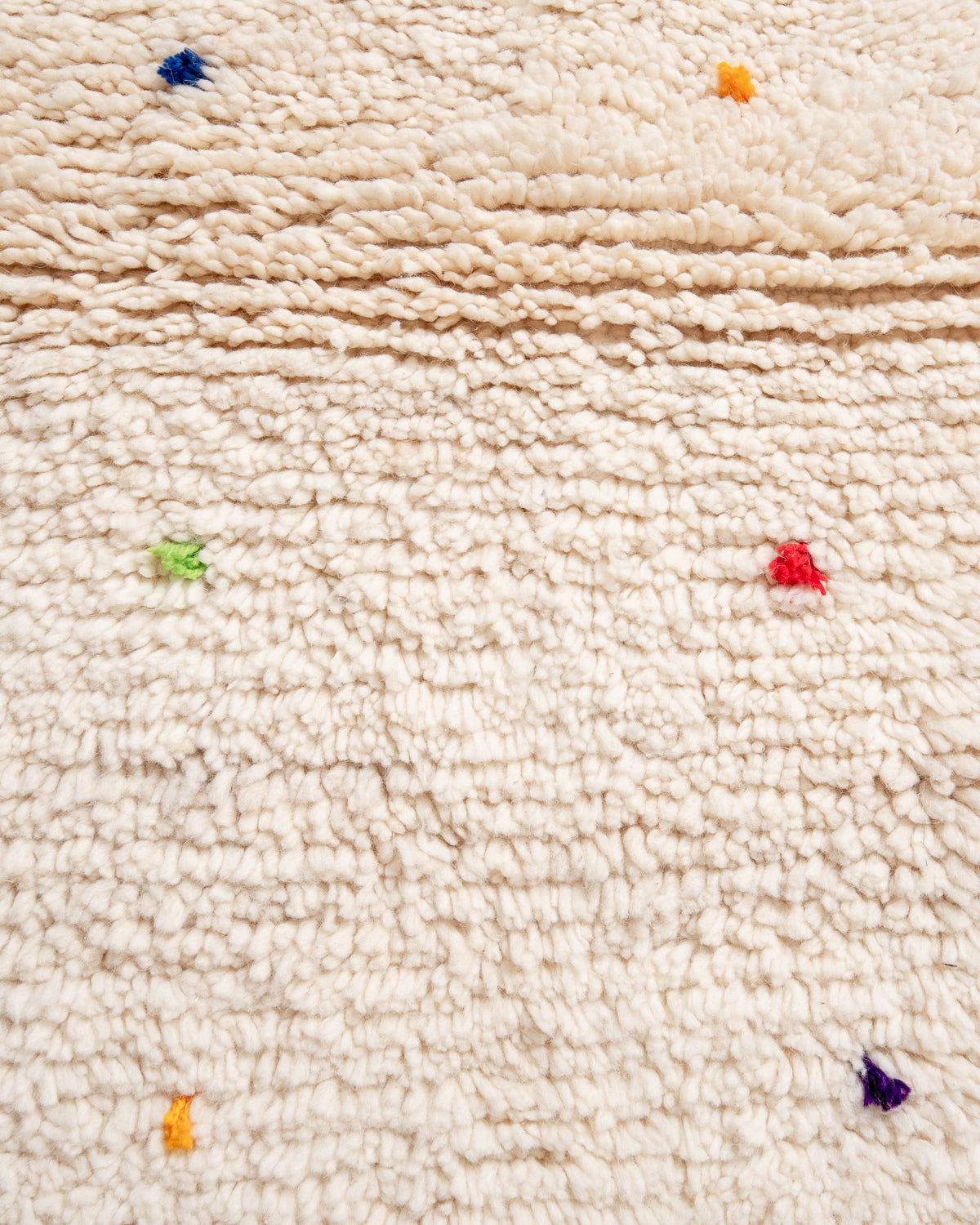 Modern, designer, handcrafted Berber rug from Morocco. Beniourain carpet with beautiful colours and patterns and fluffy wool texture.